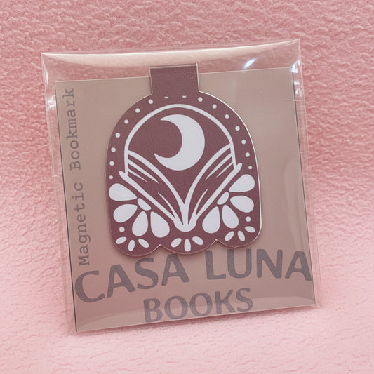 Magnetic bookmark with Casa Luna Books logo on a purple card