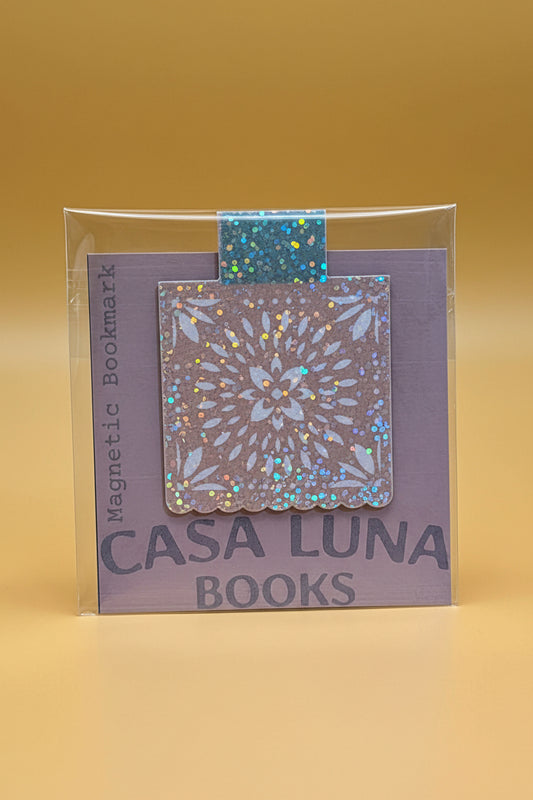 Magnetic bookmark with glittery design in clear packaging, branded 'Casa Luna Books'.