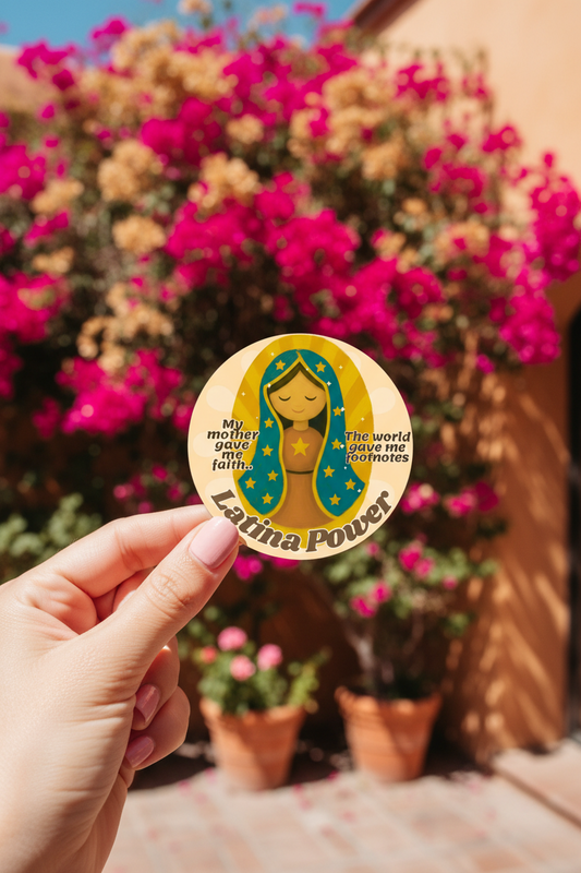 A circular graphic design featuring a stylized Latina woman with closed eyes, wearing a teal blue veil with yellow stars and a brown dress. The text reads 'My mother gave me faith.
