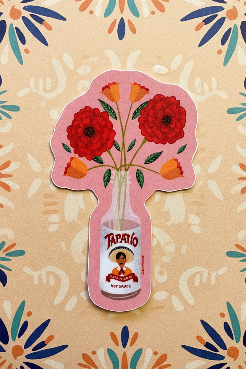 Sticker with red flowers and a bottle labeled 'Tapatio' on a polka dot background