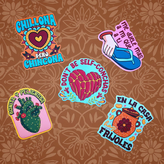 Five colorful die-cut stickers with Mexican-themed designs and text, arranged on a solid yellow background.